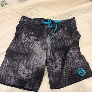 Pelagic Black and Teal Board Shorts